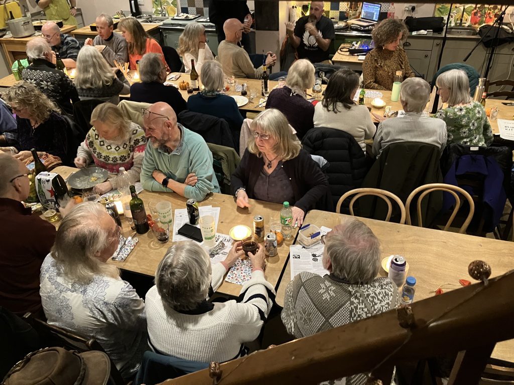 audience seated at dining tables