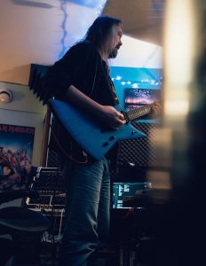 man playing electric guitar