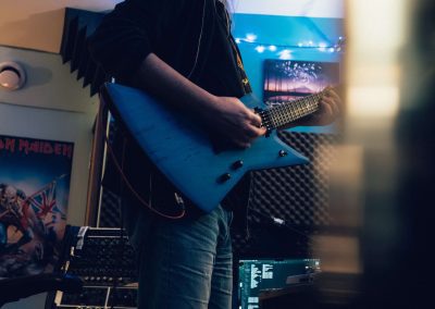 man playing electric guitar